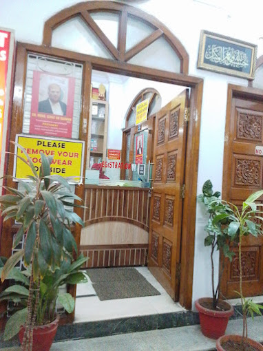 NeoDent Dental Hospital Mehdipatnam — the carved entrance doorway
